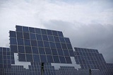 Solar panels are seen under a cloudy sky in Bad Hersfeld